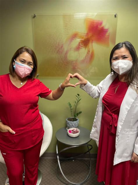 FHP posing in their red attire in... - FHP Health Center