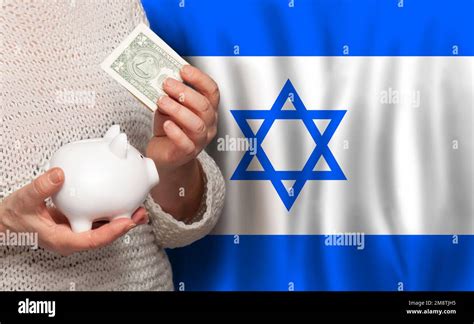 Izraeli woman with money bank on the background of Izrael flag. Dotations, pension fund, poverty ...