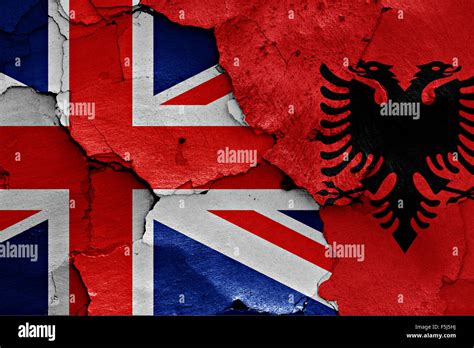 flag of UK and Albania painted on cracked wall Stock Photo - Alamy