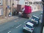 Video: Near miss as hefty lorry doors unfold towards passengers at bus stop | Daily Mail Online