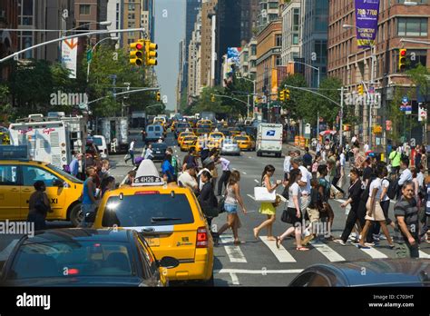 Traffic and pedestrians on crowded city streets in Manhattan in New York City Stock Photo - Alamy