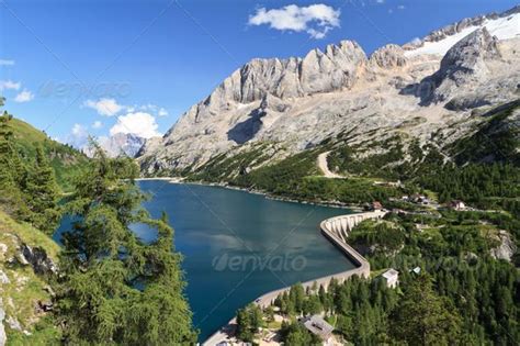 Fedaia pass with lake by Antonio-S. summer view of mount Marmolada and ...