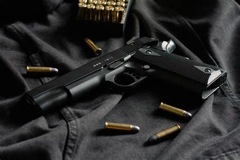 Download Gun And Bullets Wallpaper | Wallpapers.com