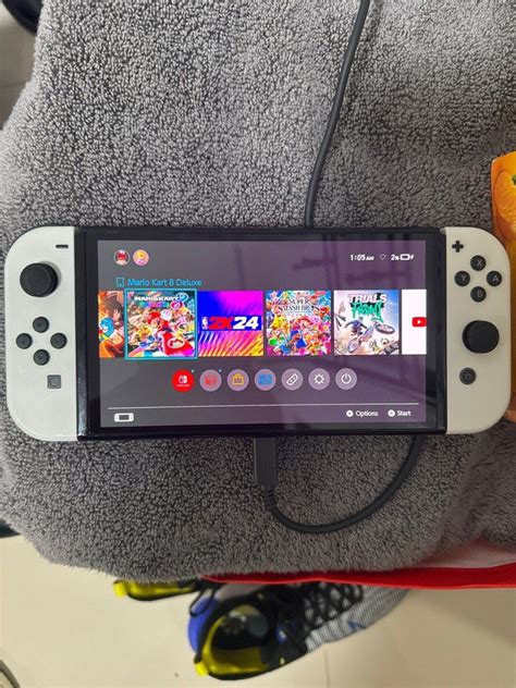 Nintendo Switch Oled with Games and Case, Video Gaming, Video Game Consoles, Nintendo on Carousell