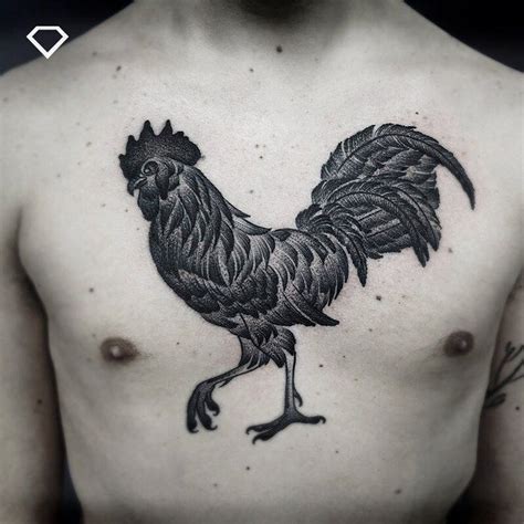 a black and white photo of a man with a rooster tattoo on his chest,