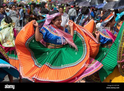 June 17, 2017 Pujili, Ecuador: female dancer in traditional clothing in motion at the Corpus ...