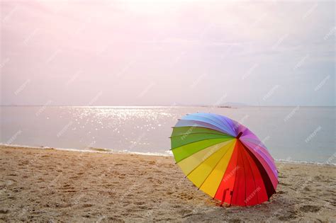 Premium Photo | Umbrella colorful on beach background