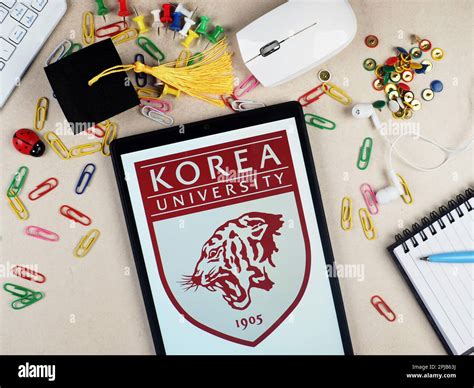 In this photo illustration, a Korea University logo seen displayed on a ...