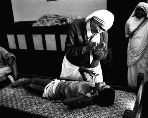 Mother Teresa Helping Boy Poster by Retro Images Archive - Pixels