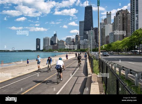 Lakefront Trail on Lake Shore Drive, Lake Michigan,with a view of the Chicago, IL skyline Stock ...