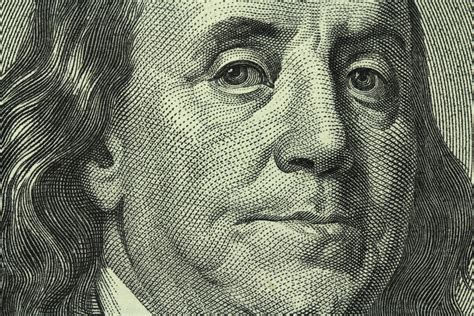 portrait of Benjamin Franklin on the hundred dollar bill closeup