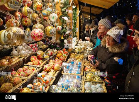 Vienna christmas market; people shopping at a christmas bauble stall, Schonbrunn Palace, Vienna ...