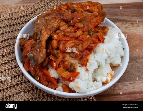 Traditional south African pap and roasted chicken, maize meal with ...