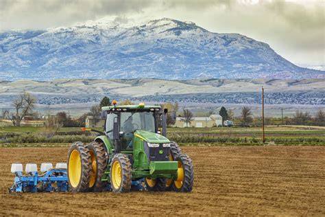 John Deer tractor/plowing field/mountains/agriculture photography