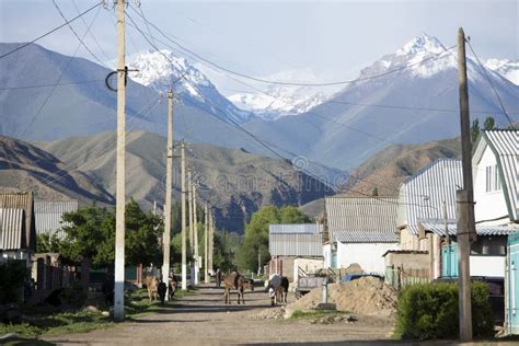 The Village of Kyzyl Tuu in Kyrgyzstan with the Tian Shan Mountains in the Background Stock ...