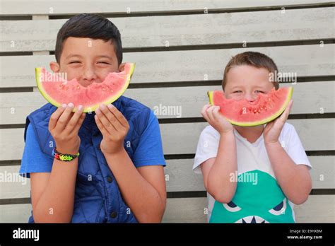 Children eating watermelon Stock Photo - Alamy