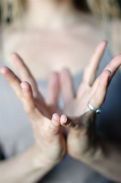 Lotus Mudra: a symbol of purity that helps to open the heart center.