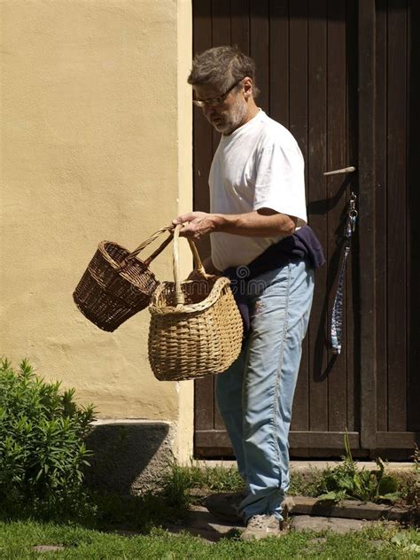 Man Leaving Home With Baskets Stock Photos - Image: 15406683