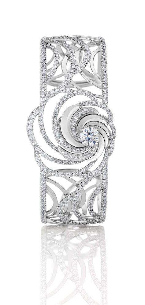 De Beers Aria diamond bracelet, with a series of swirling white gold ribbons set with pavé ...