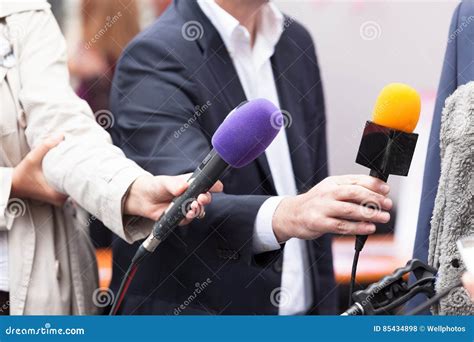 Reportes Holding Microphones, Conducting Media Interview Stock Photo ...