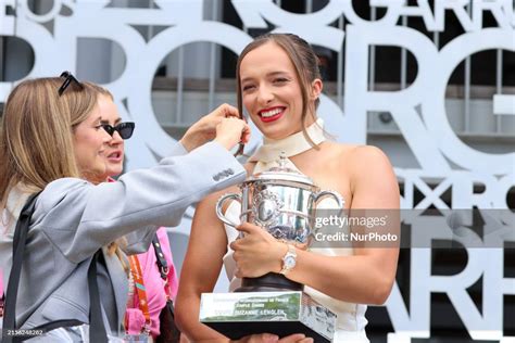 Iga Swiatek is posing during a photoshoot after winning Roland Garros... News Photo - Getty Images