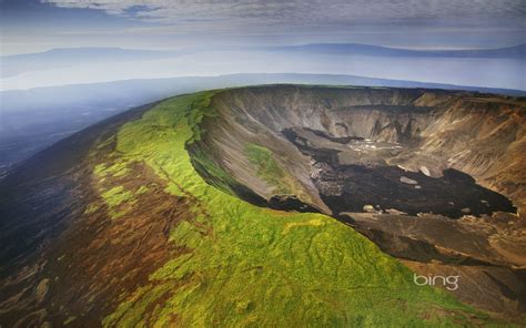 Aerial view of a volcano caldera, Isabela Island, Galápagos Islands ...