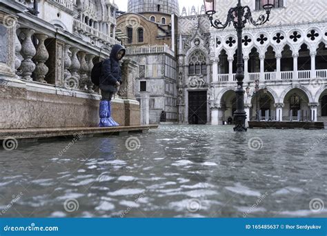 VENICE, ITALY - November 24, 2019: St. Marks Square Piazza San Marco during Flood Acqua Alta in ...