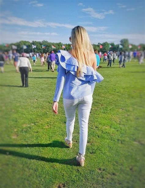 Polo match at Newport Polo grounds in Rhode Island. Wearing blue and white striped one shoulder ...