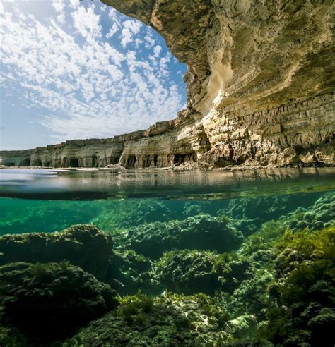 View of the Cliffs and Sea Caves of Cape Greco from Under the Wa Stock Image - Image of greco ...