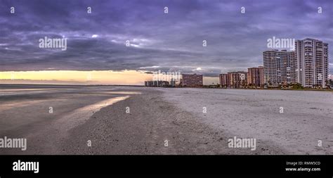 Sunset and clouds over the calm water of Tigertail Beach on Marco ...