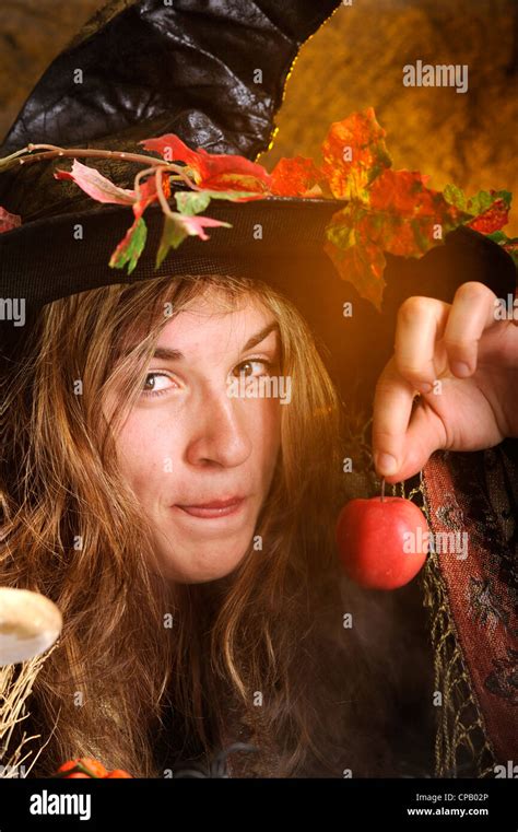 witch giving a poisoned apple Stock Photo - Alamy