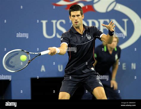 Novak Djokovic, returns a fore hand during his match against Carlos ...