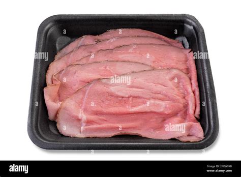 Slices of roast beef in black food plastic tray isolated on white with clipping path, top view ...