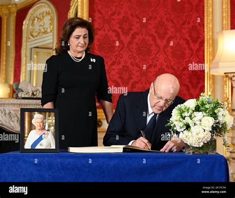 Prime Minister of Lebanon Najib Mikati and his wife May Mikati sign a ...