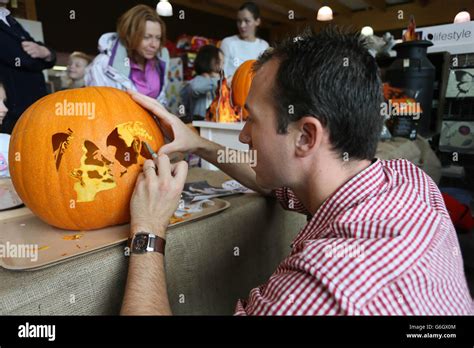 Guinness World Record pumpkin carving champion, Dave Finkle, puts the ...