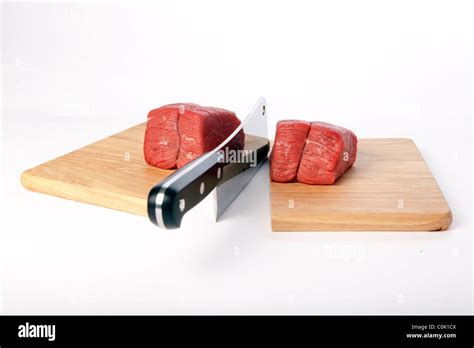 A Meat cleaver chopping board Stock Photo - Alamy