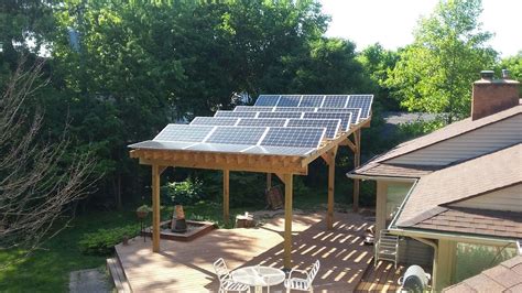 an overhead view of a patio with solar panels on the roof