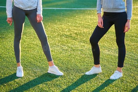 Two Girls in Sportswear Posing at the Stadium.Portrait of Two Sports ...