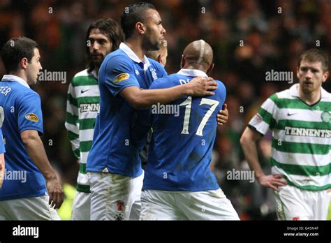 Rangers El -Hadji Diouf (second right) is restrained by team-mate Kyle Bartley Stock Photo - Alamy