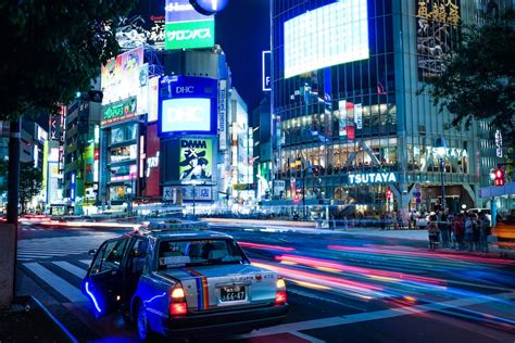 timelapse photo of vehicle near buildings during night photo – Free Japan Image on Unsplash