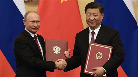 China's Xi Jinping gives Vladimir Putin friendship medal