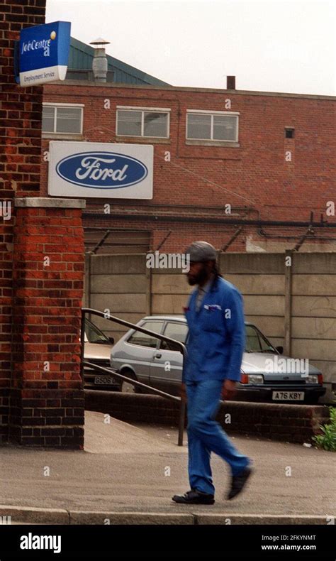 Ford Dagenham Car Plant Closure May 2000A Ford worker walks out of the Ford factory and past the ...