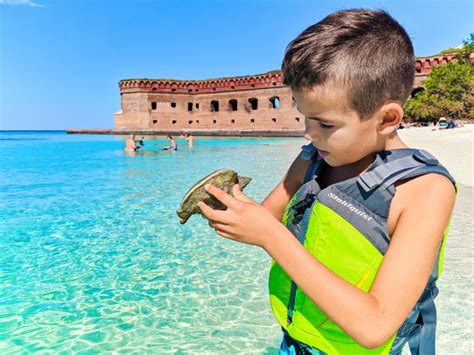 Taylor Family with conch at Beach in Dry Tortugas National Park Key West Florida Keys 2020 2 ...