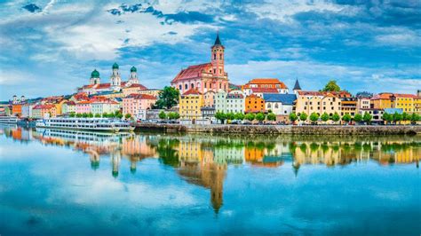 The city of Passau reflecting in the Danube River, Bavaria, Germany ...