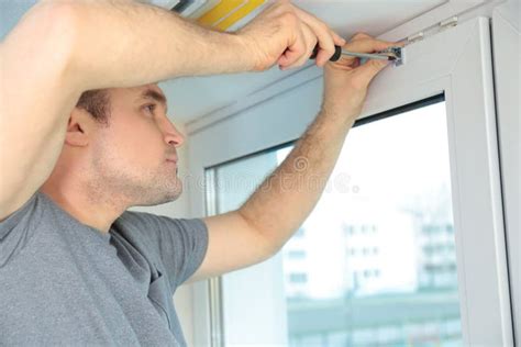 Young Man Installing Window Shades Stock Image - Image of light ...