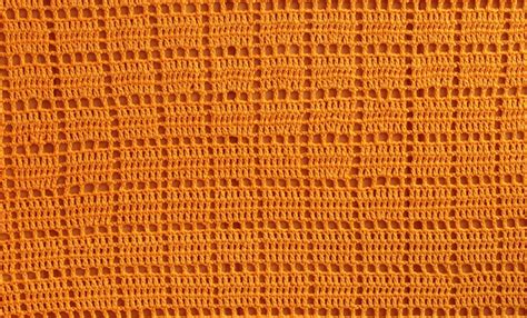 Premium Photo | Background texture of knitted orange squares for the ...