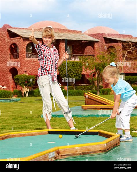 Children playing golf Stock Photo - Alamy