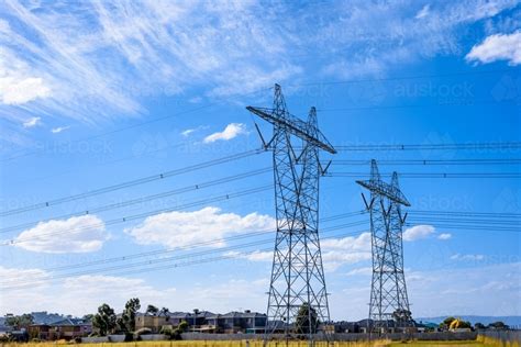 Image of High voltage power transmission tower on blue sky background, electricity distribution ...