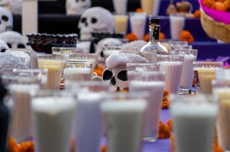 Premium Photo | Candles with glass vase placed on an altar for the day of the dead