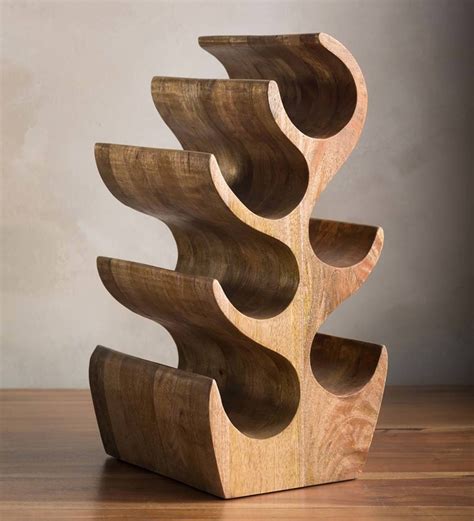 This beautiful and unique solid wood wine rack stand is hand carved from 1-piece of mango wood ...